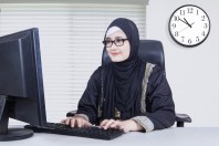 Arabian businesswoman typing on a keyboard