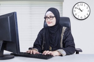 Arabian businesswoman typing on a keyboard