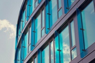 Blue brise soleil sun breakers on modern office glass building