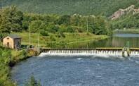 Landscape with a dam on Meuse river in Ardennes, France near Fumay in sunny summer day