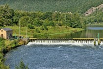 Landscape with a dam on Meuse river in Ardennes, France near Fumay in sunny summer day