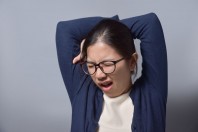 Asian Glasses Woman Yawning.