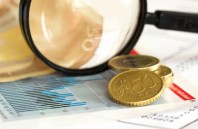 Finance: Price index graph magnifying glass and euro currency