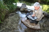 Biologist testing quality of stream water