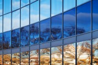 Modern metal and glass wall with bright reflections