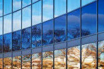 Modern metal and glass wall with bright reflections