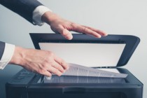 Hands of businessman copying document